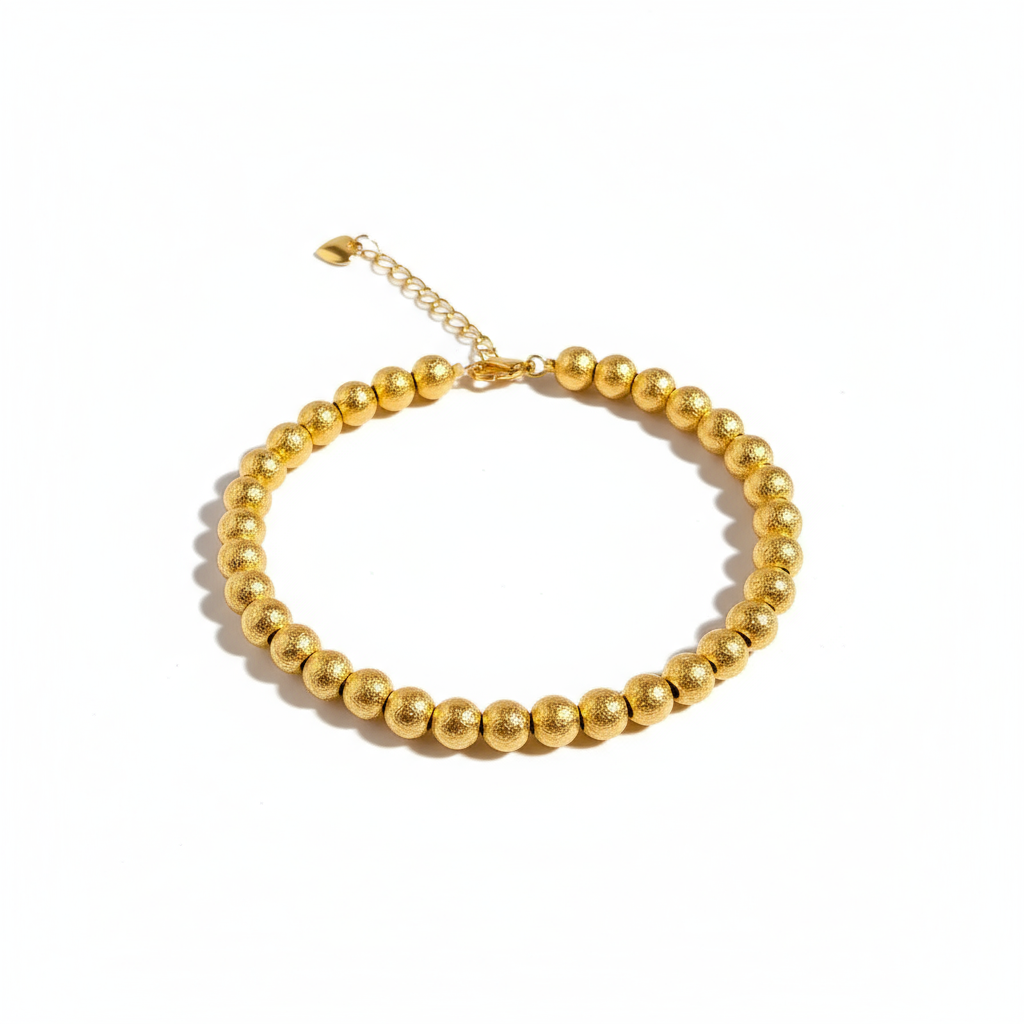 Gold bracelet on white background