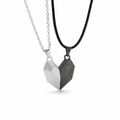 Matching heart necklaces on white background
